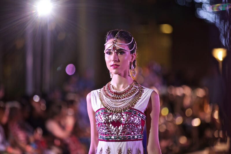 Model wearing Indian dress and headpiece